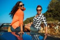 Two young girls having fun in the cabriolet outdoors Royalty Free Stock Photo