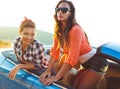 Two young girls having fun in the cabriolet outdoors Royalty Free Stock Photo