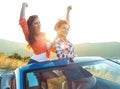 Two young girls having fun in the cabriolet outdoors Royalty Free Stock Photo