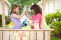 Two young girls high fiving