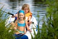 Two young girls at a lake Royalty Free Stock Photo