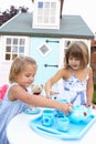 Two young girls play outdoors Royalty Free Stock Photo