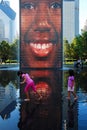 Two young girls play in the waters of the Crown Fountain Royalty Free Stock Photo