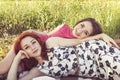 Two young girls on a rest outdoors Royalty Free Stock Photo