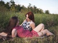 Two young girls on a rest outdoors Royalty Free Stock Photo