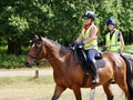 Two young girls riding horse in Richmond Park.