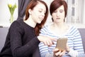 Two young girls with smart phone Royalty Free Stock Photo