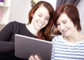 Two young girls with tablet computer Royalty Free Stock Photo