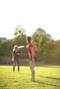 Two young girls are throwing a frisbee Royalty Free Stock Photo