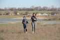 Two young girls on a walk in the countryside.