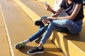 Two young girls watching mobile phones Royalty Free Stock Photo