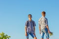 Two young guys against the sky, a relationship with each other Royalty Free Stock Photo