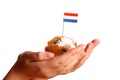 Two young hands offering a typical Dutch donut Royalty Free Stock Photo