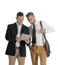 Two young handsome businessmen working with digital tablet Royalty Free Stock Photo