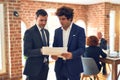 Two young handsome businessmen working together Royalty Free Stock Photo