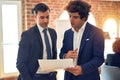 Two young handsome businessmen working together Royalty Free Stock Photo