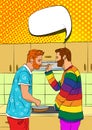 Two young handsome gay couple cook at home in the kitchen. Royalty Free Stock Photo