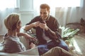 Two young handsome men drinking coffee and chatting Royalty Free Stock Photo