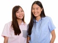 Two young happy Asian teenage girls smiling Royalty Free Stock Photo