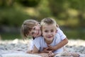 Two young happy cute blond smiling children, boy and girl, broth Royalty Free Stock Photo