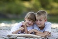 Two young happy cute blond smiling children, boy and girl, broth Royalty Free Stock Photo