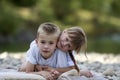 Two young happy cute blond smiling children, boy and girl, broth Royalty Free Stock Photo