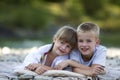 Two young happy cute blond smiling children, boy and girl, broth Royalty Free Stock Photo