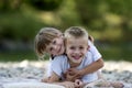 Two young happy cute blond smiling children, boy and girl, broth Royalty Free Stock Photo