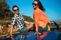 Two young happy girls having fun in the cabriolet outdoors Royalty Free Stock Photo