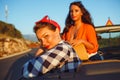 Two young happy girls having fun in the cabriolet outdoors Royalty Free Stock Photo