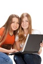 Two young happy student girl work on laptop Royalty Free Stock Photo