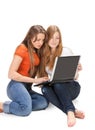 Two young happy student girl work on laptop Royalty Free Stock Photo