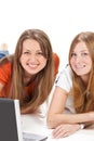 Two young happy student girl work on laptop Royalty Free Stock Photo