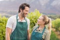 Two young happy vintners looking at each other Royalty Free Stock Photo