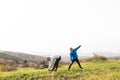 Two young hipster runners in sunny autumn nature stretching legs Royalty Free Stock Photo