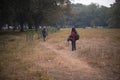 Two young Indian sisters walking in a field in winter afternoon. Royalty Free Stock Photo