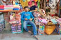 Two young Iranian traders trade textiles in the Grand Bazaar.