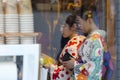 Two Young Japanese Girls Wearing Traditional Geisha`s Kimono At A Restaurant of Kyoto, Japan Royalty Free Stock Photo