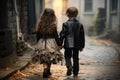 Two young kids walking down a city street, holding hands and enjoying their time together, little boy and girl walk down the Royalty Free Stock Photo