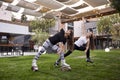 Two young ladies, 20-29 years old, doing some kind of exercise in jump boots, Royalty Free Stock Photo