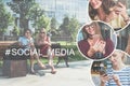 Two young laughing women in dresses sitting on a park bench, rest after shopping and using their smartphones. Royalty Free Stock Photo