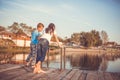 Two young little best friends, boy and girl fishing on a lake in a sunny summer day Royalty Free Stock Photo