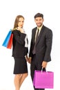 Two young male businessmen and a woman in a hand holding a separate shopping paper bag on a white background Royalty Free Stock Photo
