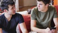 Two young men talking and chatting Royalty Free Stock Photo