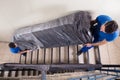 Two Movers Carrying Furniture On Staircase Royalty Free Stock Photo