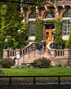 Two young male students walking up the stair to the entrance of the university library in Lund Sweden