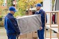 Two Male Worker Unloading Furniture From Truck Royalty Free Stock Photo