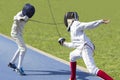 Two young man fencing athletes fight