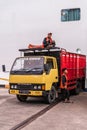 Two young man and their truck in Denpasar, Bali Indonesia