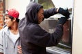 Two Young Men Breaking Into House Royalty Free Stock Photo